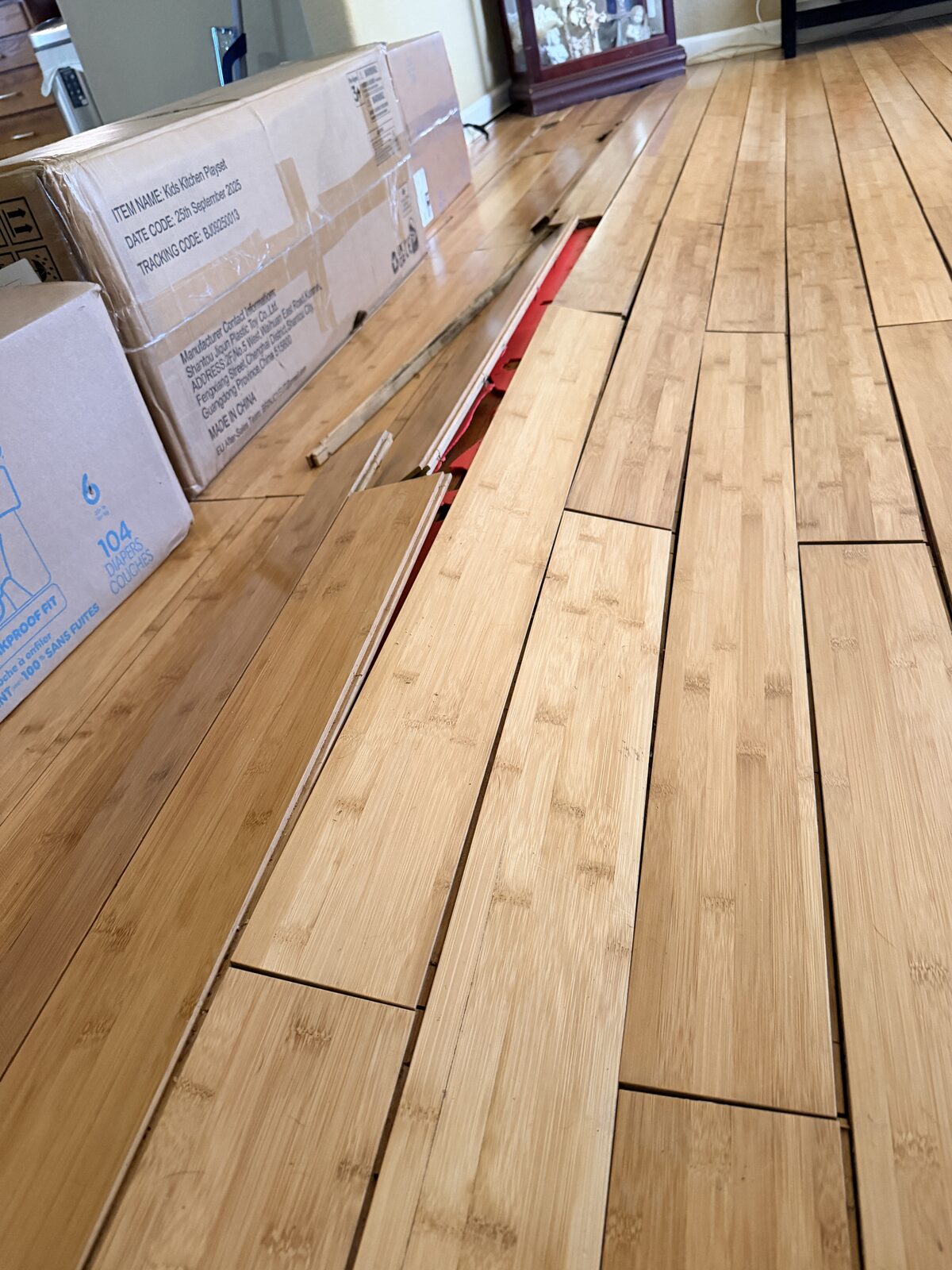 Bamboo plank flooring buckled and lifting off the subfloor