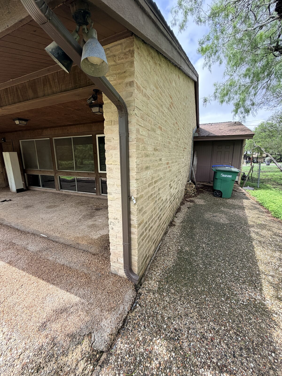 Covered back patio and brick column of a ranch home evaluated for foundation repair