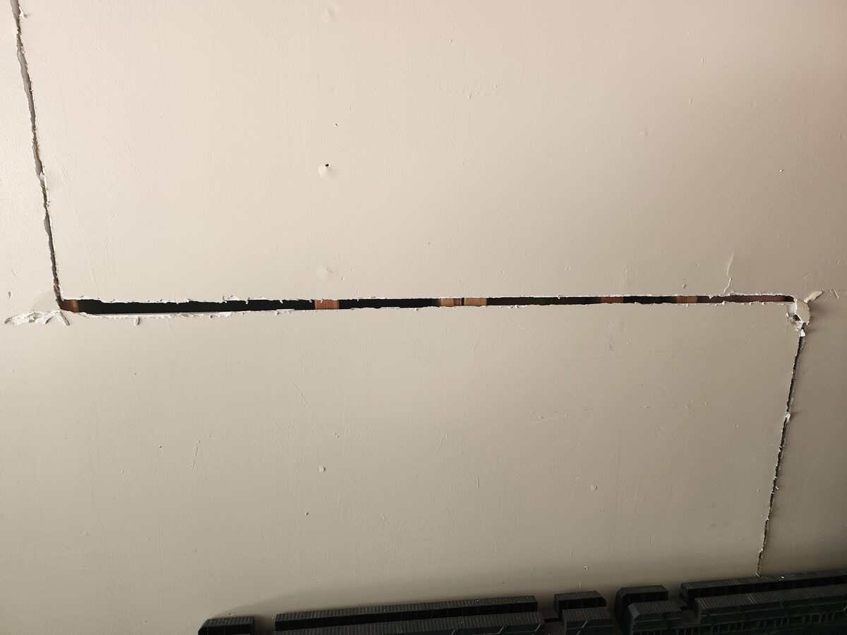 Long horizontal crack running across garage drywall, flagged during a home foundation inspection
