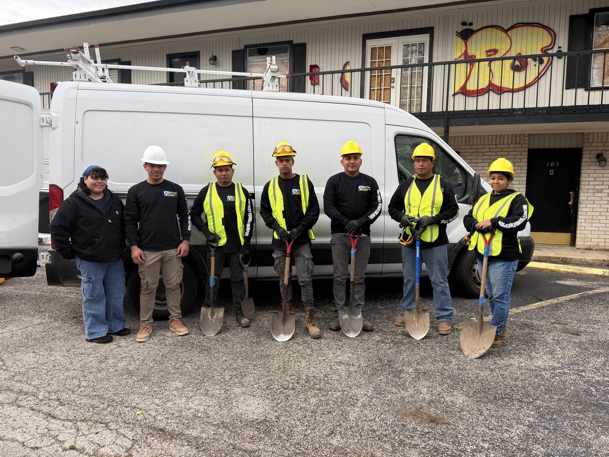 Motmot Foundation Repair crew standing together beside a company van