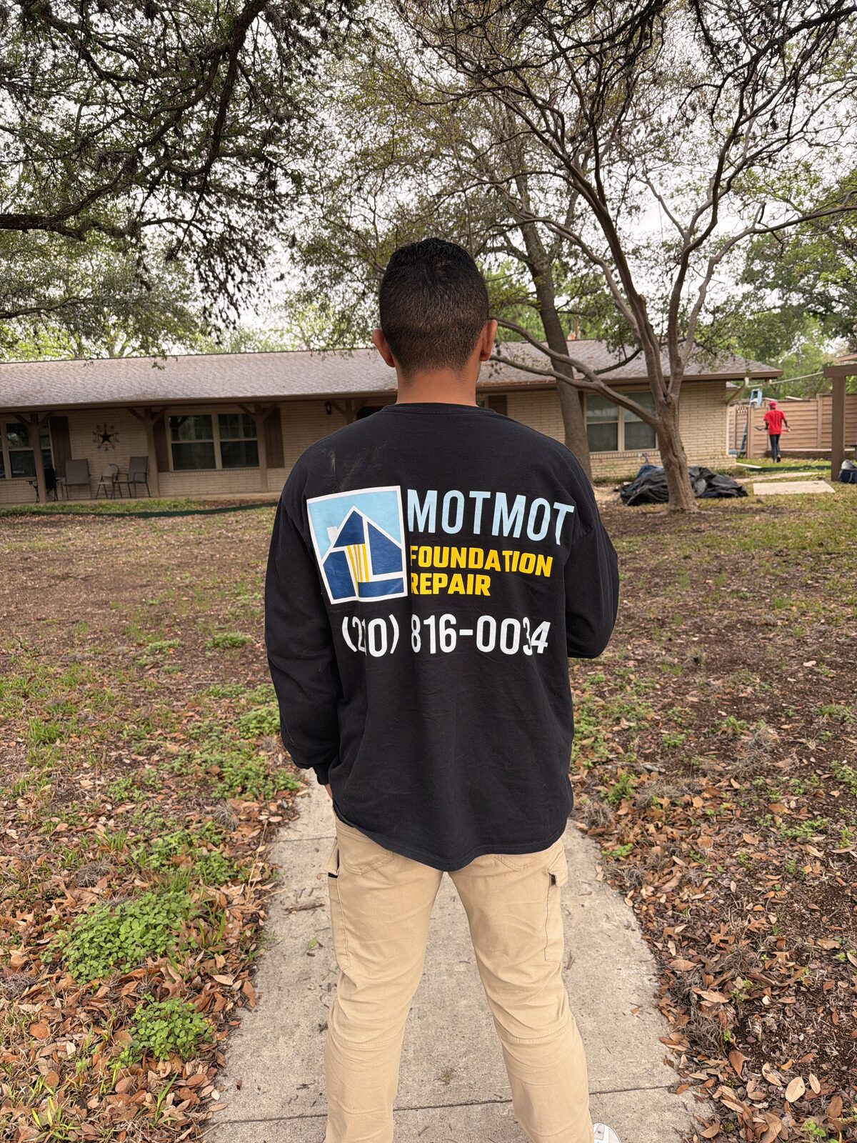 Motmot technician overlooking an active foundation repair jobsite