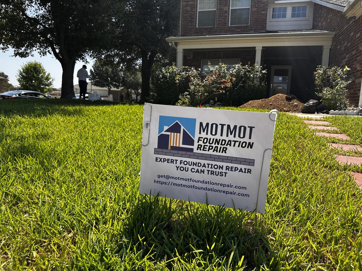 Motmot Foundation Repair yard sign on the lawn of a completed foundation repair project