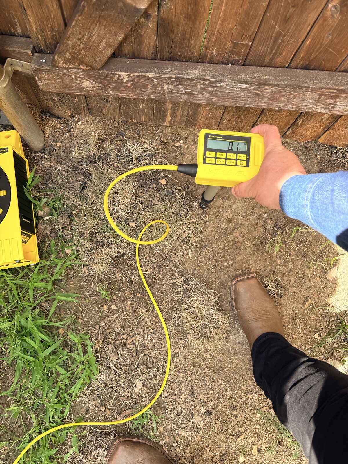 ZipLevel elevation reading being recorded during a floor elevation survey